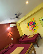 Coastal Nest room with floral wall artwork
